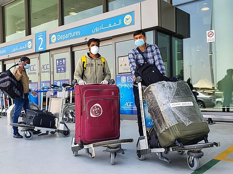 Passengers at Dubai International's Terminal-2 ahead of the first Air India Express repatriation flight to Kozhikode in Kerala.