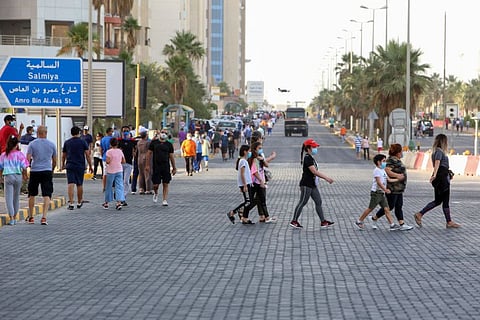 Kuwaiti police use a drone to monitor residents walking in a neighbourhood of Kuwait city on May 12 as authorities allowed people to exercise for two hours under a nationwide lockdown due to the COVID-19 pandemic.