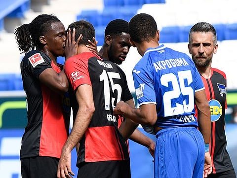 Hertha Berlin's Dedryck Boyata, left, celebrates with Marko Grujic during the Bundesliga win over Hoffenheim