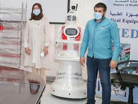 Smart machines check patients' temperatures, serve medication, food