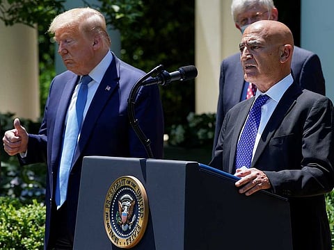 Former GlaxoSmithKline pharmaceutical executive Moncef Slaoui, who will serve as chief adviser on the effort to find a vaccine for the coronavirus disease (COVID-19) pandemic, speaks as US President Donald Trump listens during a coronavirus disease response event in the Rose Garden at the White House in Washington, US, May 15, 2020.