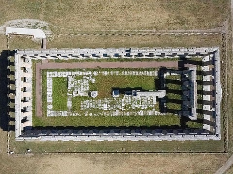 This aerial view shows The First Temple of Hera at Paestum near Naples on May 22, 2020. Ahead of the Colosseum and Pompeii, the towering Greek temple complex at Paestum near Naples is the first Italian archaeological site to reopen to tourists after the coronavirus pandemic lockdown.