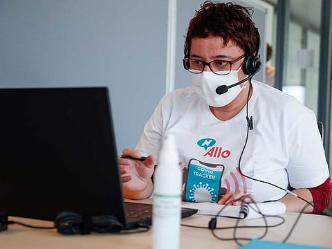 An operator works in a call center dedicated to COVID-19 (novel coronavirus) tracing.