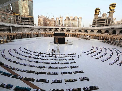 Worshippers gathering before the Kaaba at the Grand Mosque in Saudi Arabia's Mecca to attend the prayers of Eid Al Fitr.