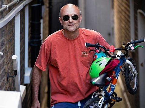 Britain's Prime Minister Boris Johnson's senior aide Dominic Cummings leaves his north London home, in London, Saturday May 23, 2020. The British government faced accusations of hypocrisy on Saturday after the revelation that Cummings travelled more than 400km to his parents’ house during a nationwide lockdown while he was showing coronavirus symptoms.