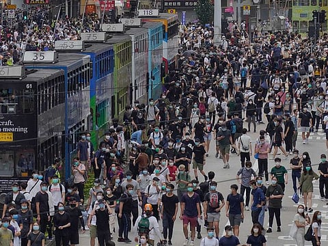 Pro-democracy protesters march during a protest against Beijing's national security legislation in Hong Kong, Sunday, May 24, 2020. Hong Kong's pro-democracy camp has sharply criticised China's move to enact national security legislation in the semi-autonomous territory. They say it goes against the "one country, two systems" framework that promises the city freedoms not found on the mainland.