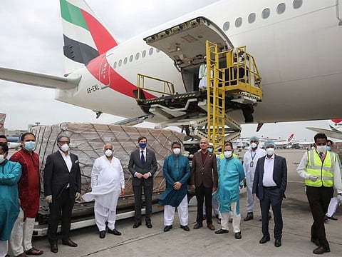 The PPE gowns being loaded on a flight