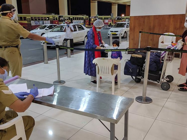 Passengers arrive at Kochi International Airport on an an Air-India flight, as part of the government's 'Vande Bharat' mission to bring home stranded Indians from various foreign locations.