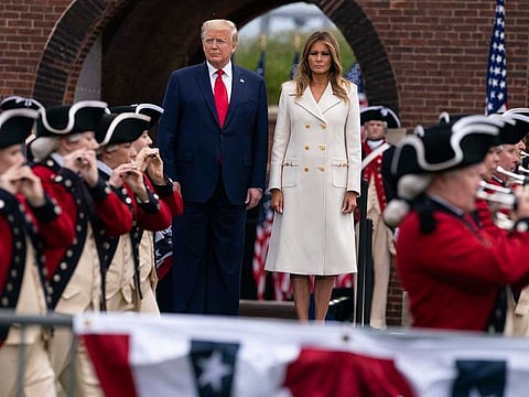 President Donald Trump and first lady Melania Trump participate in a Memorial Day ceremony at Fort McHenry National Monument and Historic Shrine, Monday, May 25, 2020, in Baltimore.