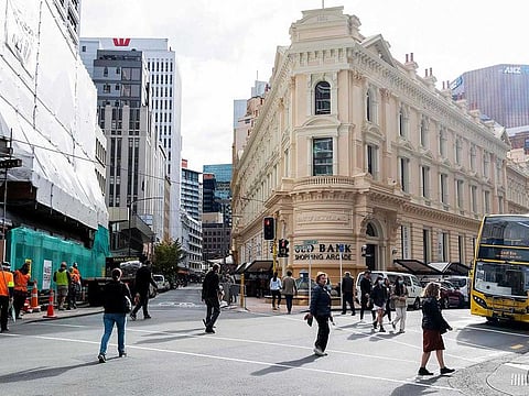 People walk on a street in Wellington on May 14, 2020. Two new coronavirus cases were reported in New Zealand on Tuesday, June 16, 2020, ending a 24-day run without COVID-19 cases.