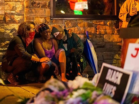 Shawanda Hill (C), the girlfriend of George Floyd reacts near the spot where he died while in custody of the Minneapolis Police, on May 26, 2020 in Minneapolis, Minnesota.