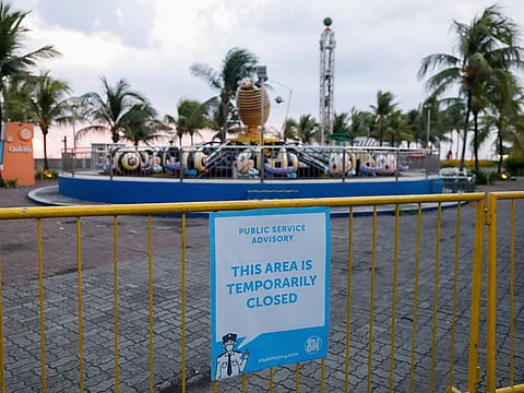 A poster announcing temporary closure is placed on a barrier outside an amusement park amid the coronavirus disease (COVID-19) outbreak, in Manila, Philippines May 27, 2020.
