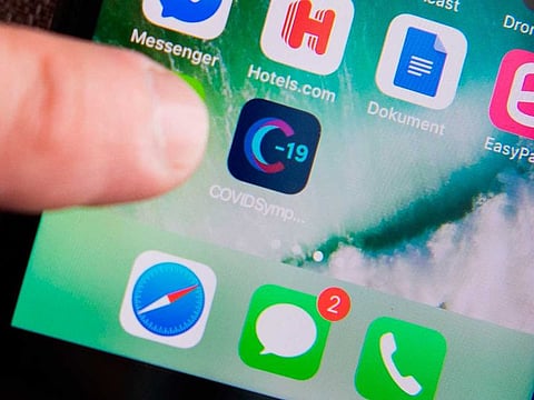 A Swedish version of the Covid Symptom Tracker app on a smartphone in Stockholm