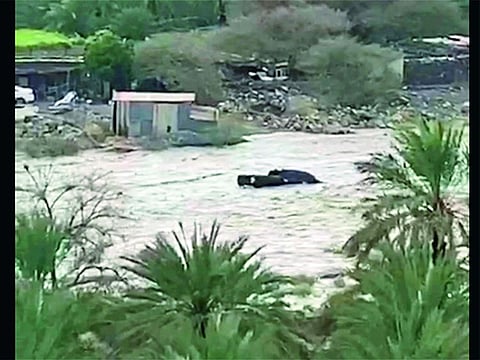 One of three cars swept away in Wadi Al Helo, in which four people died, on May 26