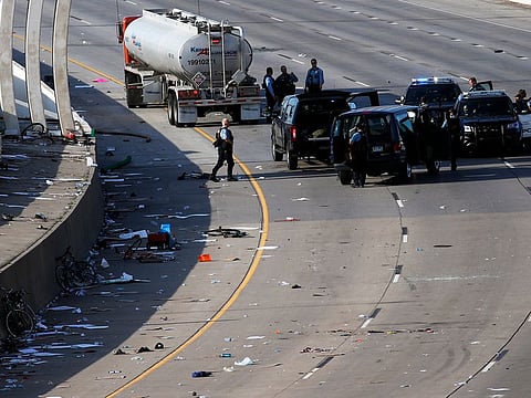 Police clear the area where a tanker truck rushed to a stop among protesters on an interstate Sunday, May 31, 2020, in Minneapolis.