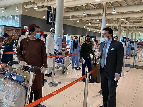 Consul General of Afghanistan in Dubai Masood Azizi meeting passengers flying back home on special flights from Dubai Inernational Airport.