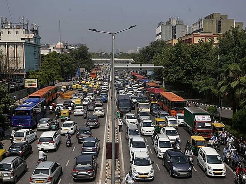 Traffic seen at Vikas Marg near ITO after the government lifted restrictions on movement during coronavirus lockdown, in New Delhi on Monday. Delhi chief minister Arvind Kejriwal said on Monday that the state's borders would be sealed for a week in an attempt to fight the spread of the coronavirus.