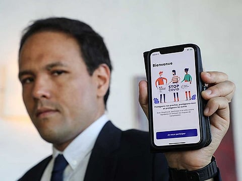French Junior Minister for the Digital Economy Cedric O presents the StopCovid contact tracing app at his office at the Economy Ministry, in Paris.
