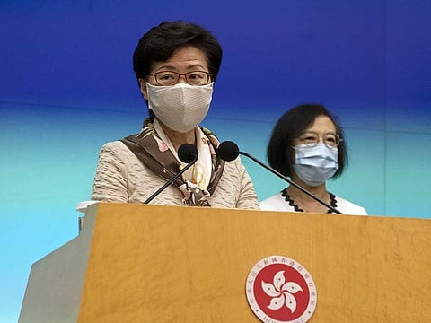 Carrie Lam, Hong Kong's chief executive, left, speaks while wearing a protective mask as Sophia Chan, Hong Kong's secretary for food and health, listens during a news conference in Hong Kong, China, on Tuesday, June 2, 2020. Hong Kong's leader blasted the US for "double standards" in the way it handles protests after the Trump administration vocally supported sometimes-violent demonstrations in the Asian financial hub.