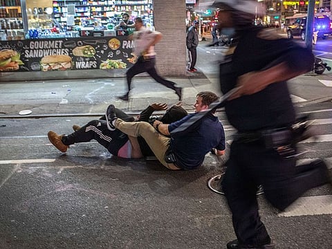 Police arrest a protester near Times Square after an 11pm curfew during a night of marches and vandalism over the death of George Floyd on June 1, 2020 in New York City.