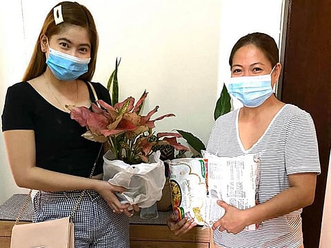 Residents swap items during the coronavirus pandemic