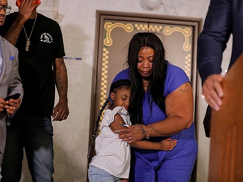 George Floyd's 6-year-old daughter, Gianna, embraces her mother, Roxie Washington, before speaking about her father, following his death in Minneapolis police custody, at the Minneapolis City Hall, in Minneapolis, U.S., June 2, 2020.