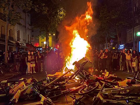 Protesters burn trash bins, shared scooters and bicycles on June 2, 2020 after a demonstration against police violence and in memory of late US citizen George Floyd who died a week before after a Minneapolis police officer knelt on his neck.