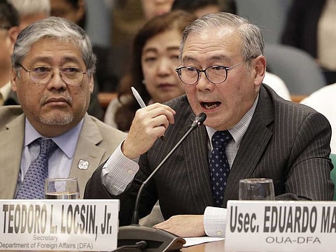 Philippine Secretary of Foreign Affairs Teodoro Locsin Jr. (right) gestures during a senate hearing in Manila, Philippines