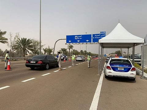 One of Abu Dhabi police's checkpoint in the Emirate of Abu Dhabi. Passengers taking flights from Abu Dhabi or Dubai airports are permitted to travel to their designated airports from either places, Abu Dhabi Police said on Wednesday. Picture courtesy: Abu Dhabi Police.