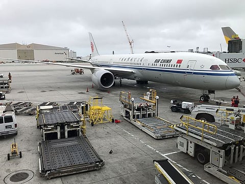 An Air China Boeing airplane sits at a gate at Los Angeles International Airport on May 24, 2018.