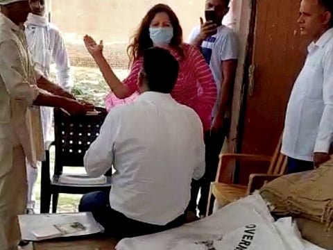 BJP leader Sonali Phogat slaps a market committee officer, alleging that he was using cuss words with a farmer during his visit to a grain market to hear their grievances, at Balsamand in Hisar district, Friday, June 5, 2020.