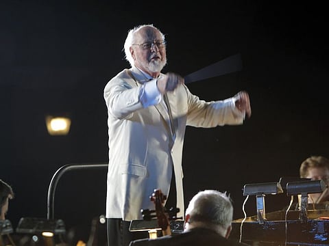 Composer and conductor John Williams leads the Orlando Philharmonic Orchestra during the grand opening celebration at the Wizarding World of Harry Potter at Universal Orlando Resort theme park in Orlando, Fla., Wednesday, June 16, 2010. Williams has composed many film scores, including Star Wars, Superman, Home Alone, the first three Harry Potter movies and many Steven Spielberg's feature films including the Indiana Jones series, Schindler's List, E.T. the Extra-Terrestrial, Jurassic Park and Jaws.(AP Photo/John Raoux)