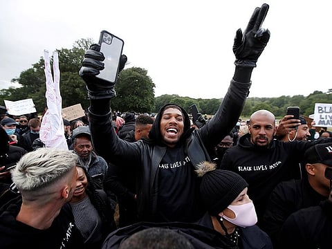 Boxer Anthony Joshua is seen with demonstrators during a Black Lives Matter protest in Watford.