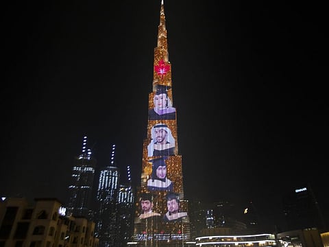 Graduates' faces shown on the side of the Burj Khalifa