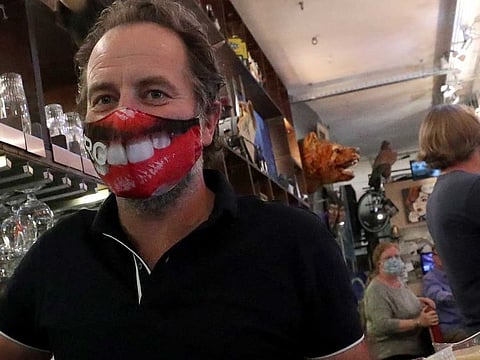 A figure with a face mask on, is seen at Inn R Green Restaurant during the reopening after weeks of lockdown restrictions amid the coronavirus disease (COVID-19) outbreak, in Brussels, Belgium, June 8, 2020.