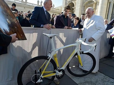 Pope with the bike donated by Sagan