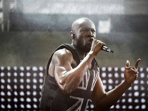 FILE PHOTO: British rapper Stormzy performs the headline slot on the Pyramid stage during Glastonbury Festival in Somerset, Britain, June 28, 2019. REUTERS/Henry Nicholls/File Photo