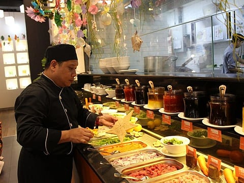 Chef Michael delo Santos used to serve 1,000 diners a day but now his restaurant has been closed for over a month