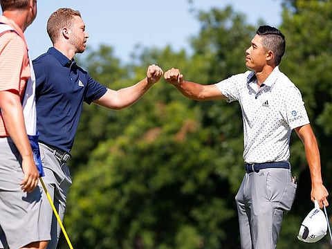 Daniel Berger is congratulated by Collin Morikawa after the play-off in the final round of the Charles Schwab Challenge.