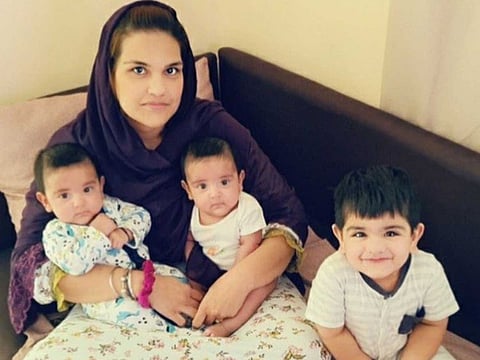 Sanjana with her twins Kiaan and Arhaan, and her two-year-old son Kabir. She has appealed for help to bring her husband, currently stranded in Pakistan, back to Dubai.