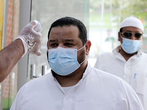 Shoppers have their temperatures checked before entering a mall in Jiddah, Saudi Arabia, Monday, June 15, 2020. This was supposed to be Saudi Arabia's year to shine as host of the prestigious G20 gathering of world leaders. Instead, due to the coronavirus pandemic, the gathering this November will likely be a virtual meet-up. The impact of the coronavirus and low oil prices have forced a recalibration of Prince Mohammed bin Salman’s ambitious plans to revamp Saudi society and its oil-dependent economy.