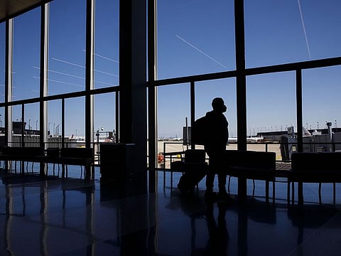 It's best to have it on... US carriers are not willing to go easy on passengers who turn up without the masks.