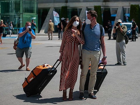 Duesseldorf-Mallorca flight passengers arrive at Son Sant Joan airport in Palma de Mallorca, Spain, Monday, June 15, 2020. Borders opened up across Europe on Monday after three months of coronavirus closures that began chaotically in March.