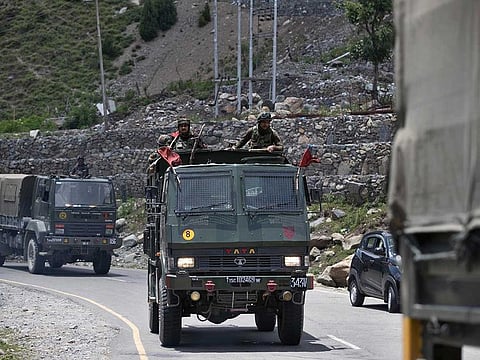 An Indian army convoy moves on the Srinagar- Ladakh highway at Gagangeer, north-east of Srinagar, India, Wednesday, June 17, 2020.