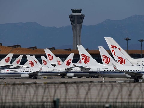 Air China planes parked on the tarmac at Beijing Capital Airport.