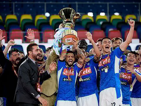 Napoli’s Lorenzo Insigne (centre), head coach Gennaro Gattuso (far left) and players celebrate after winning the Coppa Italia final.