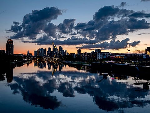 Clouds are seen over the buildings of the banking district after sunset in Frankfurt, Germany, Thursday, June 18, 2020.