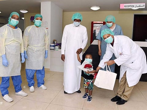 Medical staff in the Saudi city of Yanbu celebrate recovery of 2-year-old boy, Hassan, from COVID-19, in this file picture.