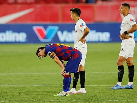 Lionel Messi looks dejected after the 0-0 draw with Sevilla.
