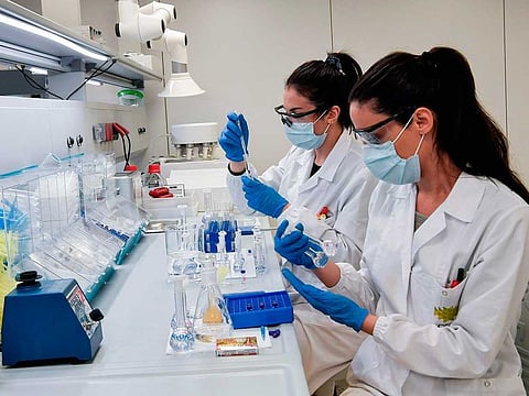 Scientists work in a lab of the Uni-pharma pharmaceutical company in a northern suburb of Athens, on June 5, 2020.